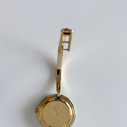 Gucci 1990s Interchangeable Bezel Gold Plated Bangle Watch with 12 bezels, case