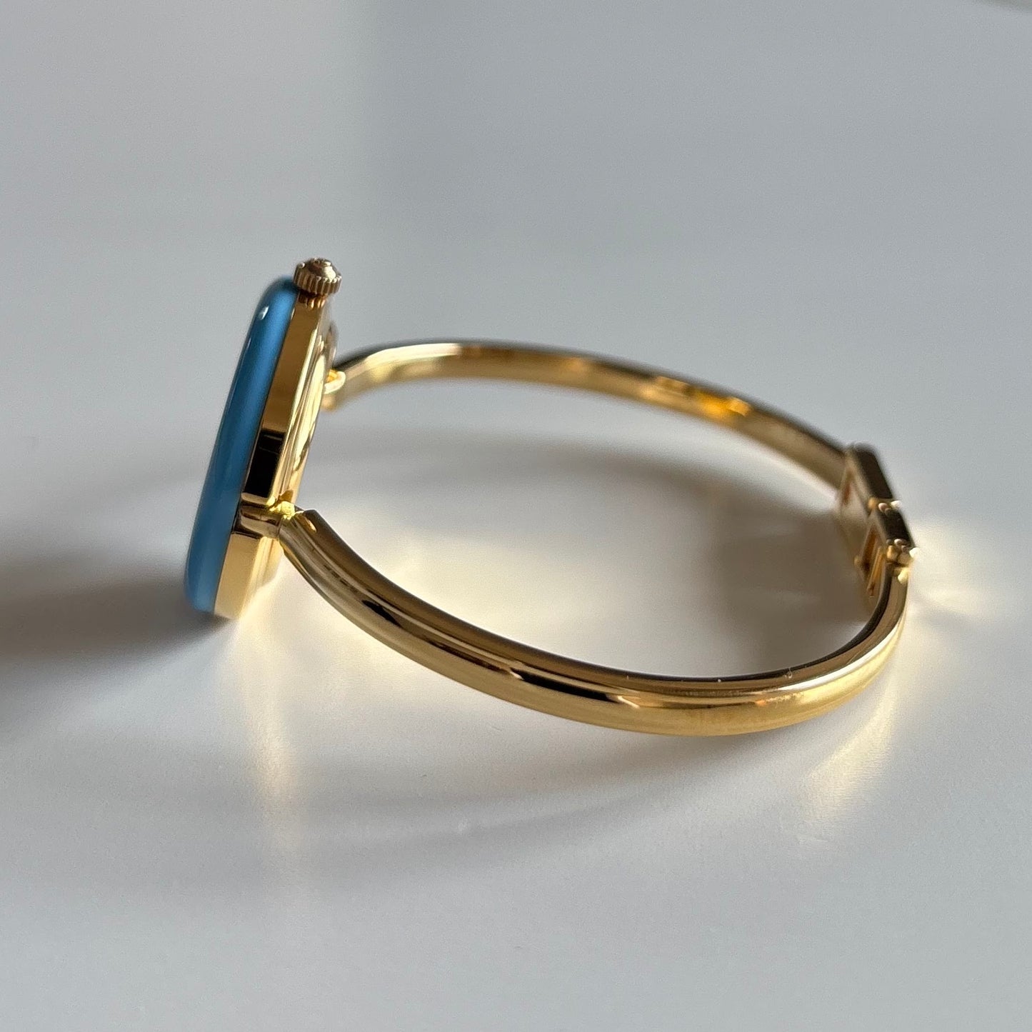 Gucci 1990s Interchangeable Bezel Gold Plated Bangle Watch with 12 bezels, case