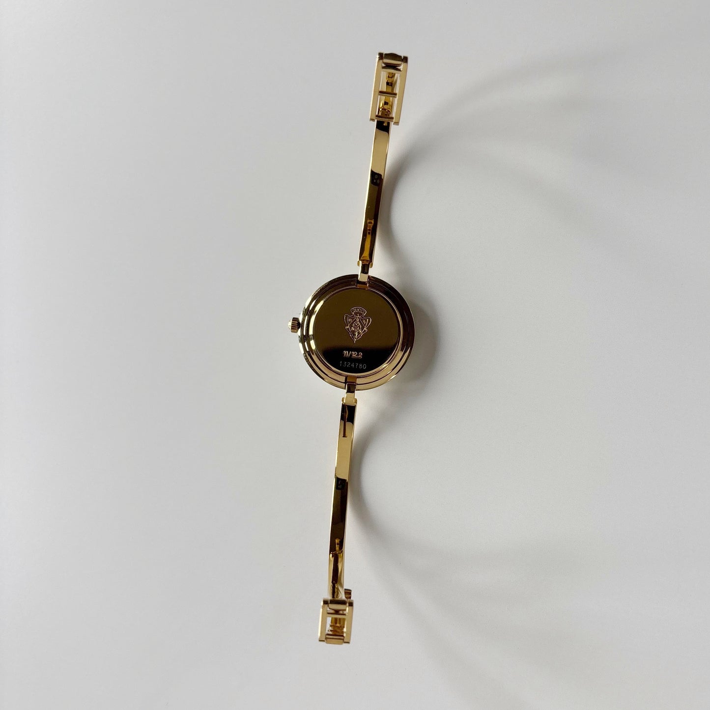 Gucci 1990s Interchangeable Bezel Gold Plated Bangle Watch with 12 bezels, case