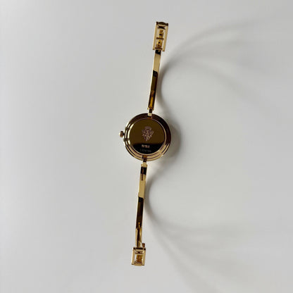 Gucci 1990s Interchangeable Bezel Gold Plated Bangle Watch with 12 bezels, case