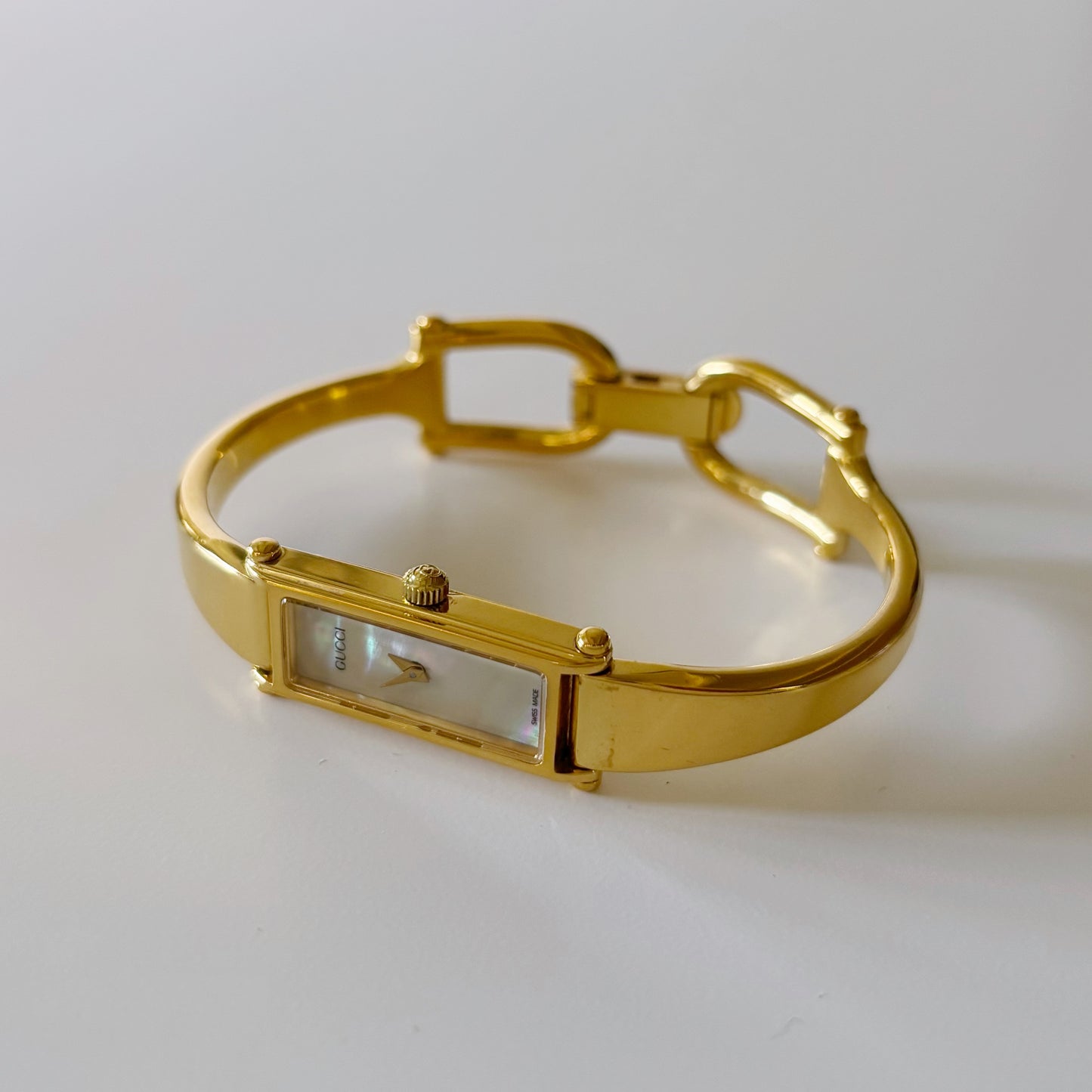 Gucci 1990s Rectangular Seashell Dial Gold Plated Bangle Watch