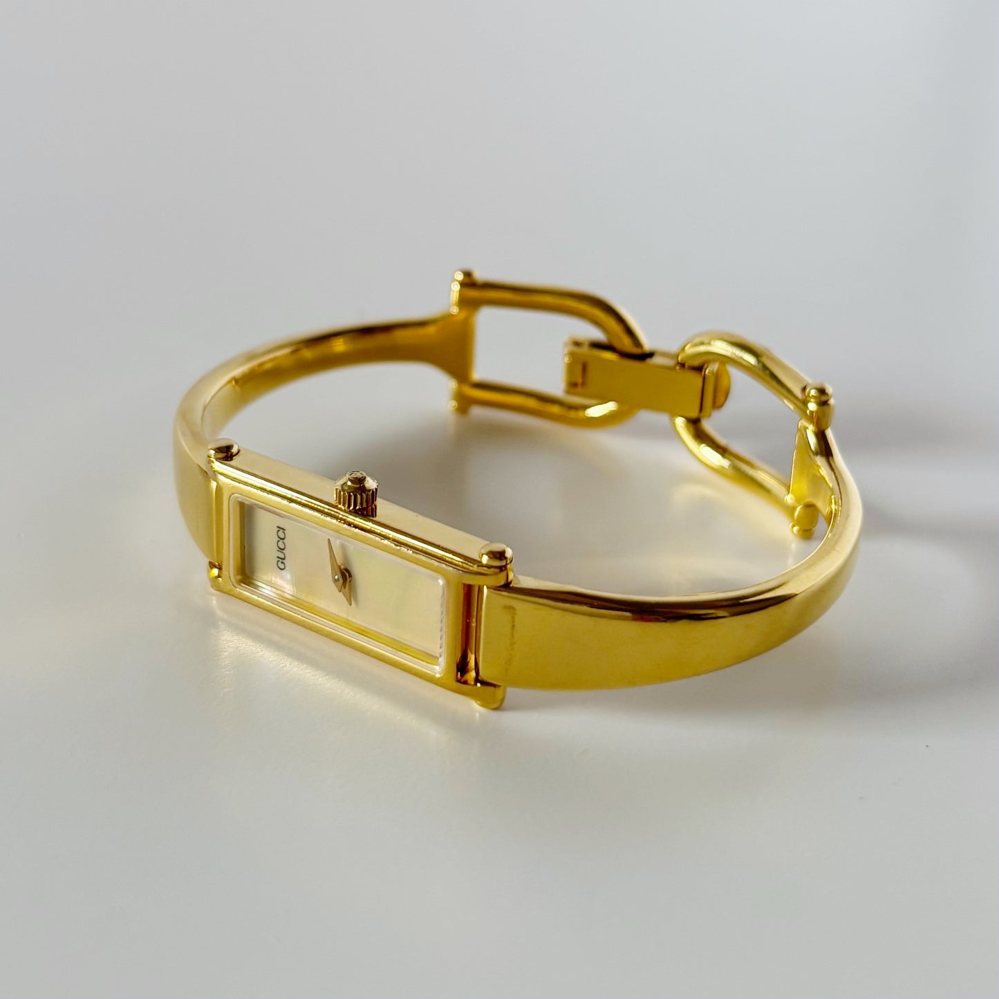 Gucci 1990s Rectangular Seashell Dial Gold Plated Bangle Watch