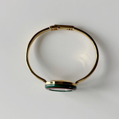Gucci 1990s Interchangeable Bezel Gold Plated Bangle Watch with 12 bezels, case
