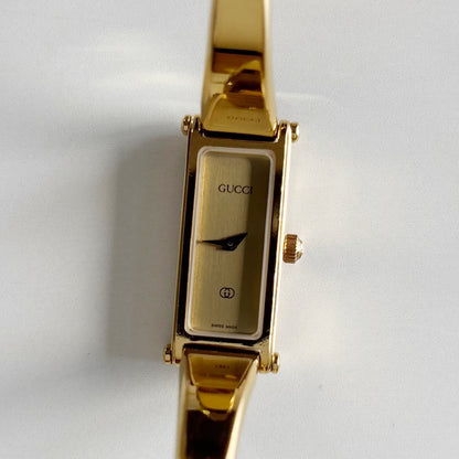Gucci 1990s Gold Rectangular Dial Gold Plated Bangle Watch