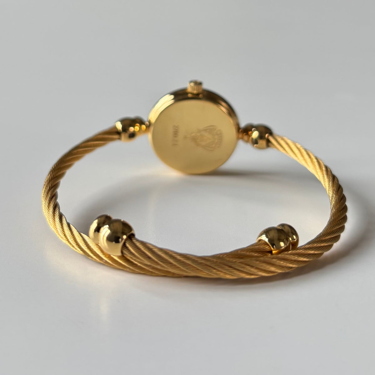 Gucci 1990s Black Round Dial Cable Gold Plated Bangle Watch