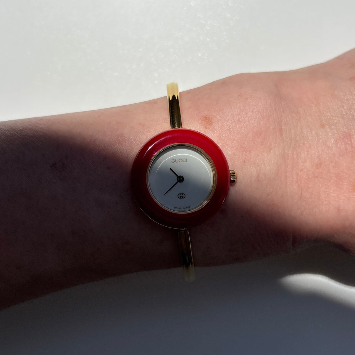 Gucci 1990s Interchangeable Bezel Gold Plated Bangle Watch with 12 bezels, case