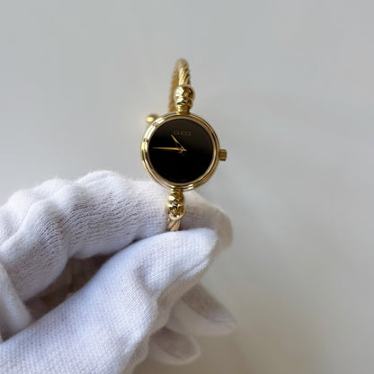 Gucci 1990s Black Round Dial Cable Gold-Plated Bangle Watch