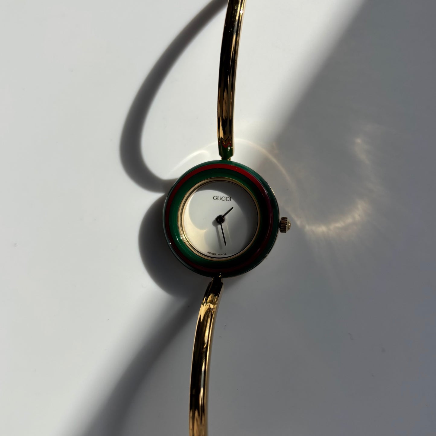 Gucci 1990s Interchangeable Bezel Gold Plated Bangle Watch with 12 bezels, case