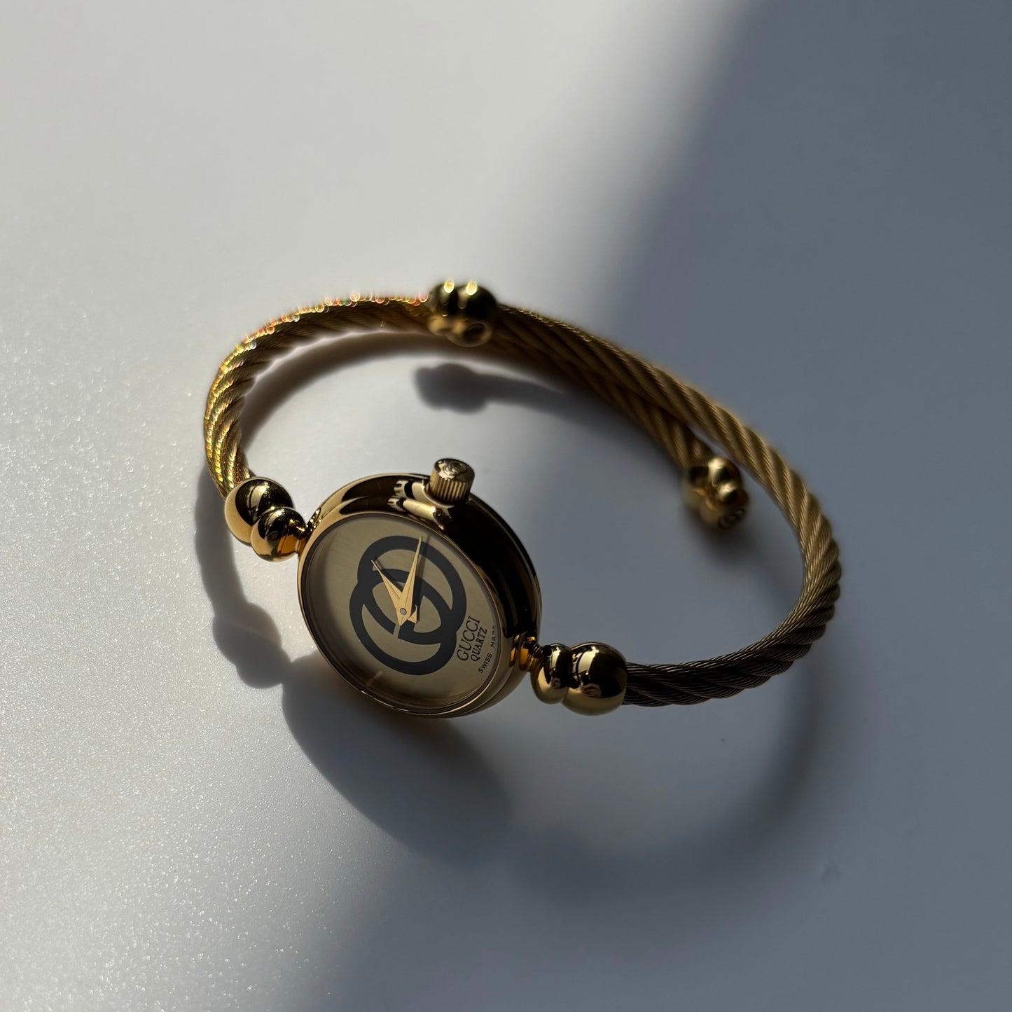 Gucci 1980s Round Dial Cable Band Bangle Watch