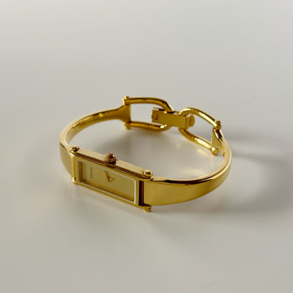 Gucci 1990s Gold Dial Rectangular Gold Plated Bangle Watch