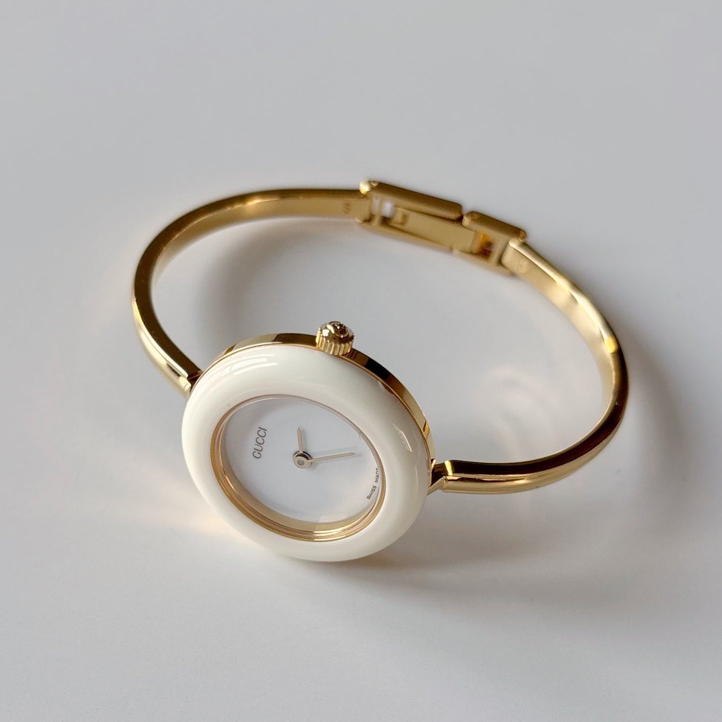 Gucci 1990s Interchangeable Bezel Gold Plated Bangle Watch with case, 12 bezels (Small)