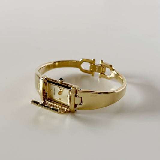 Yves Saint Laurent 1990s Peek-A-Boo Gold Plated Bangle Watch