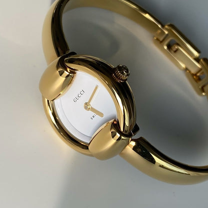 Gucci 1990s Round Dial Gold Plated Bangle Watch