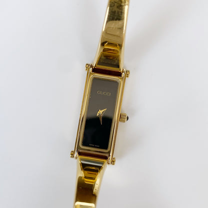 Gucci 1990s Rectangular Black Dial Gold Plated Bangle Watch