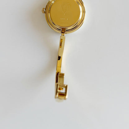 Gucci 1990s Interchangeable Bezel Gold Plated Bangle Watch with 12 bezels, case