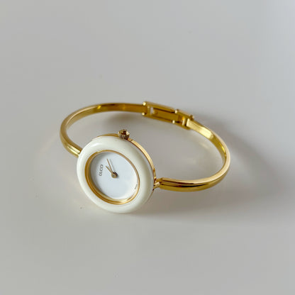 Gucci 1990s Interchangeable Bezel Gold Plated Bangle Watch with 12 bezels, case
