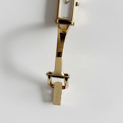 Gucci 1990s Seashell Rectangular Dial Gold Plated Bangle Watch (Small)