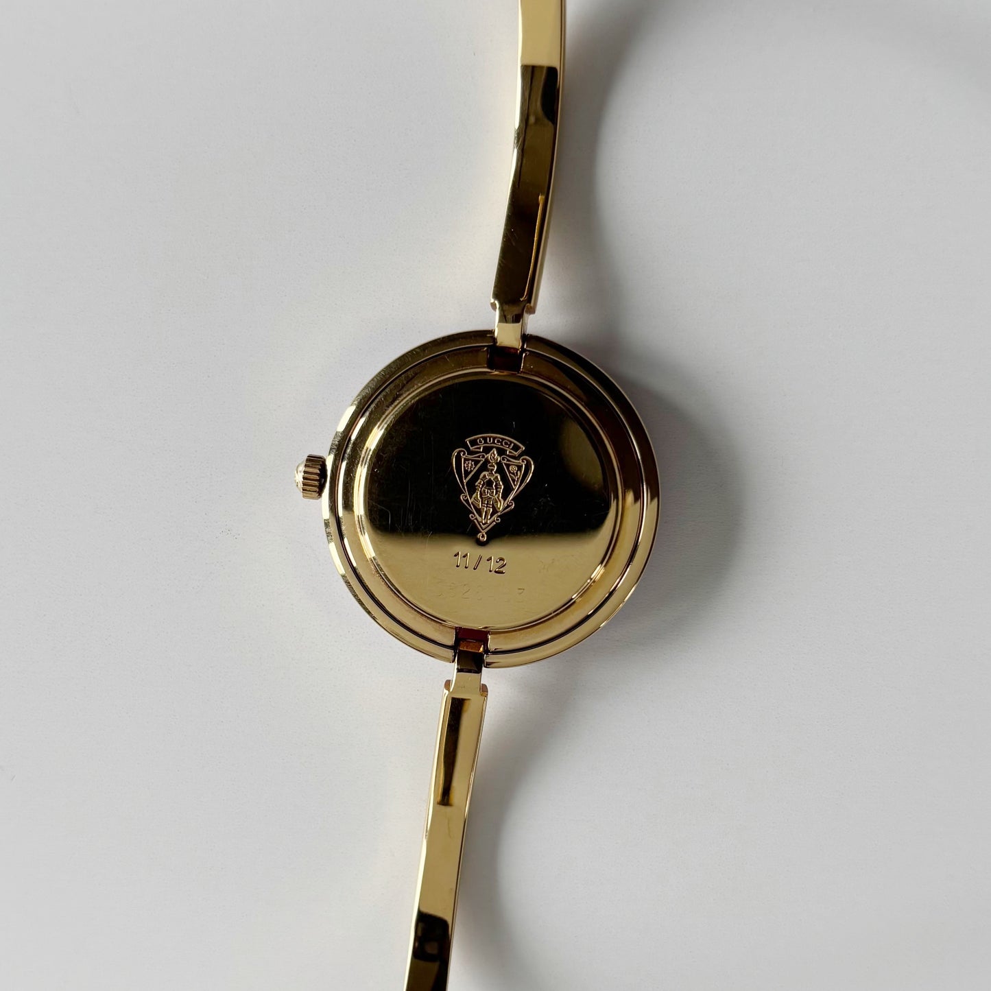 Gucci 1990s Interchangeable Bezel Gold Plated Bangle Watch with 12 bezels, case