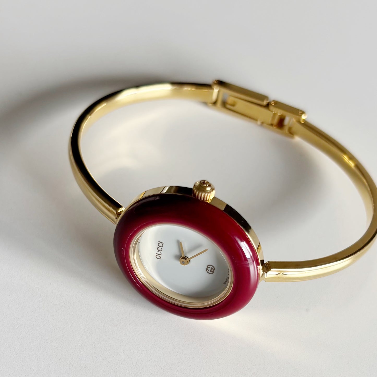 Gucci 1990s Interchangeable Bezel Gold Plated Bangle Watch with 12 bezels, case