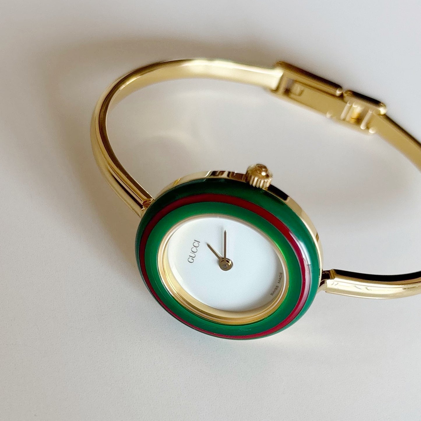 Gucci 1990s Interchangeable Bezel Gold Plated Bangle Watch with 12 bezels, case