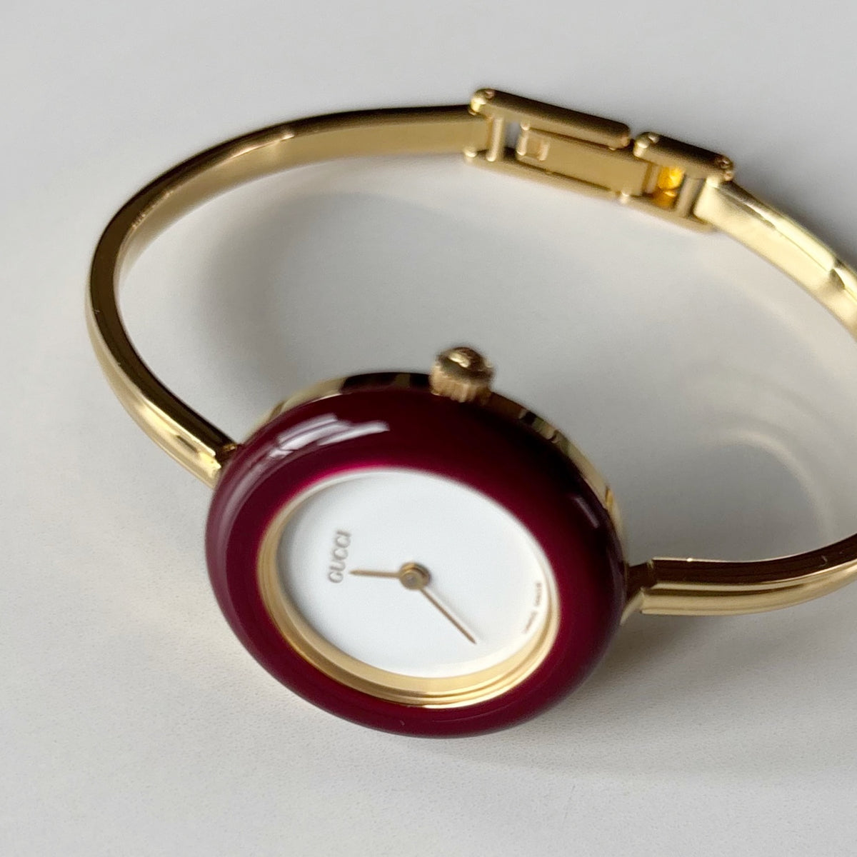 Gucci 1990s Interchangeable Bezel Gold Plated Bangle Watch with 12 bezels, case