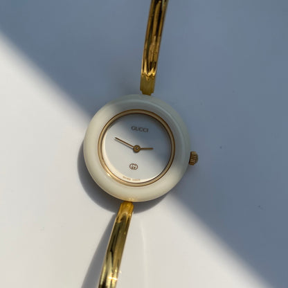 Gucci 1990s Interchangeable Bezel Gold Plated Bangle Watch with 12 bezels, case