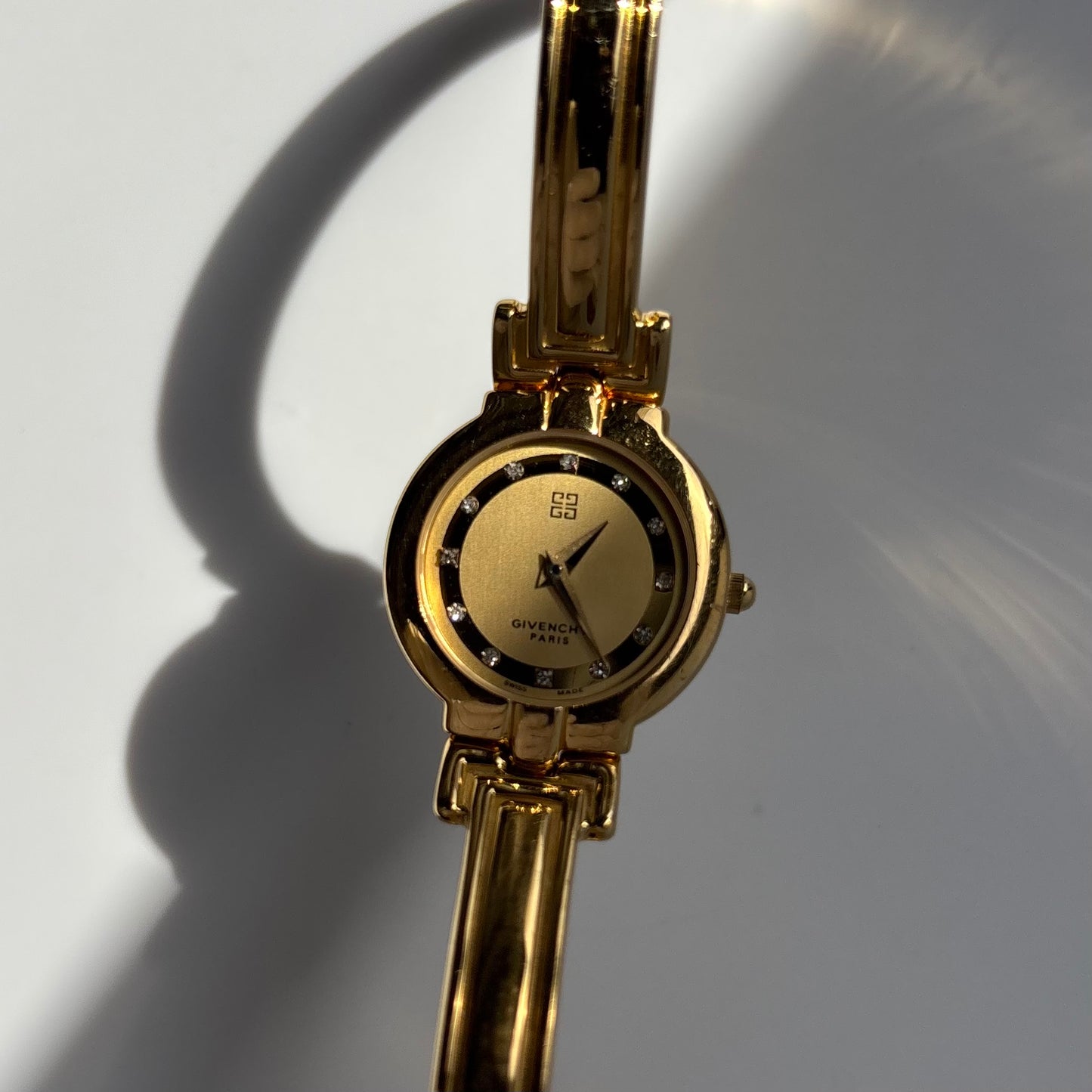 Givenchy 1990s Round Dial Gold Plated Bangle Watch