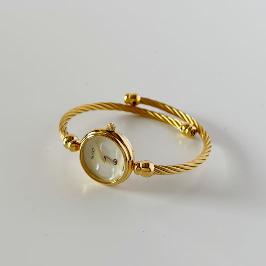 Gucci 1990s Seashell Dial Gold Plated Cable Bangle Watch