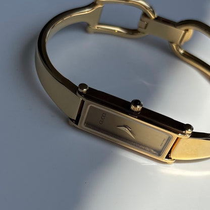 Gucci 1990s Gold Rectangular Dial Gold Plated Bangle Watch