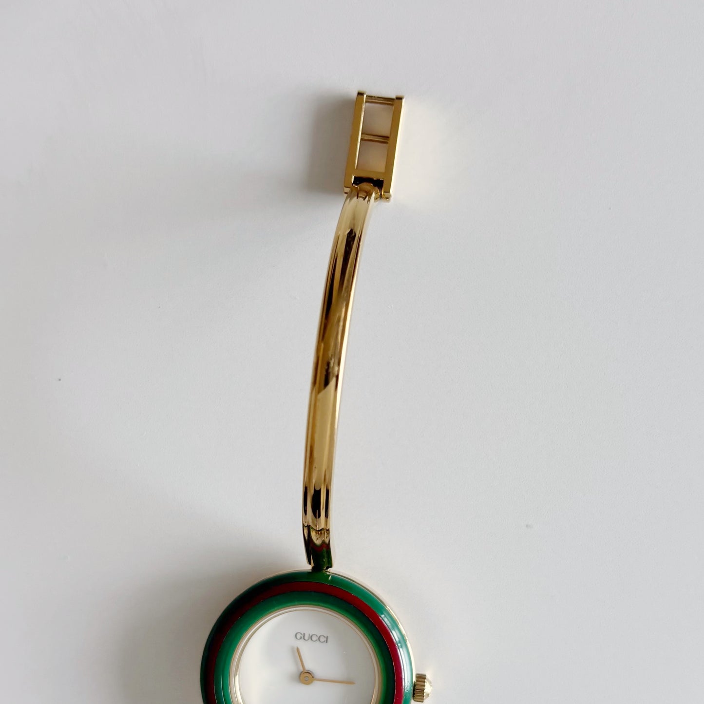 Gucci 1990s Interchangeable Bezel Gold Plated Bangle Watch with 12 bezels, case