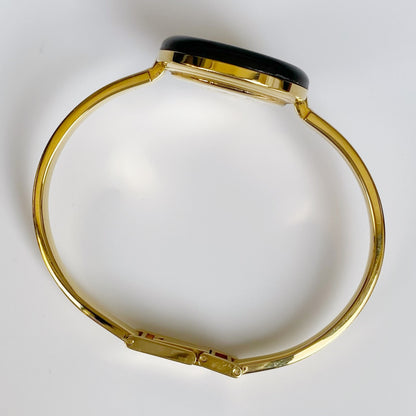 Gucci 1990s Interchangeable Bezel Gold Plated Bangle Watch with 12 bezels, case