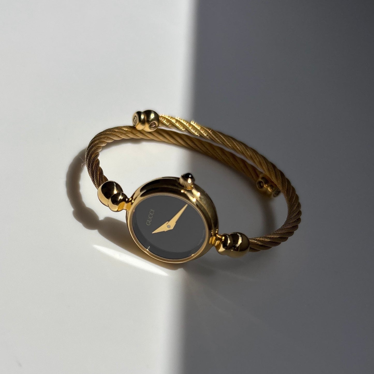 Gucci 1990s Black Dial Gold Plated Cable Bangle Watch