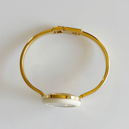 Gucci 1990s Interchangeable Bezel Gold Plated Bangle Watch with 12 bezels, case