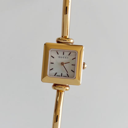 Gucci 1990s Seashell Square Dial Gold Plated Bangle Watch