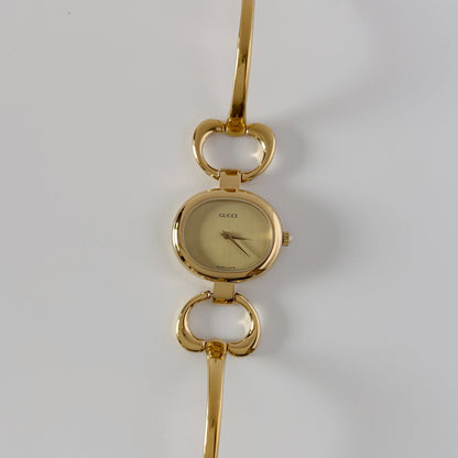 Gucci 1990s Oval Dial Gold Plated Bangle Watch
