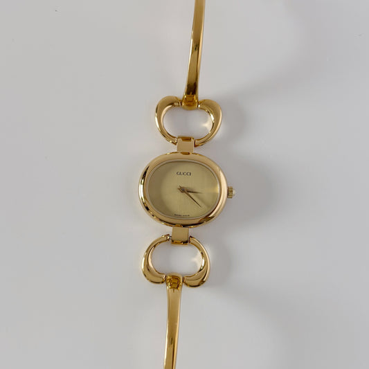 Gucci 1990s Oval Dial Gold Plated Bangle Watch
