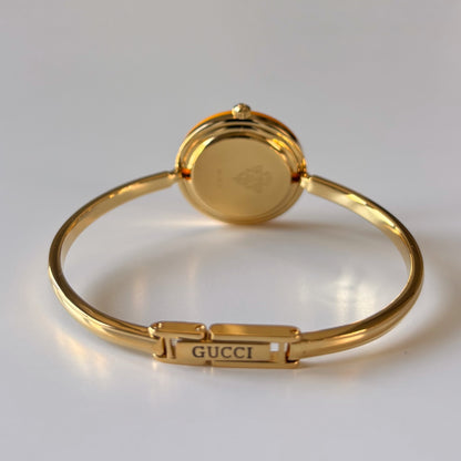 Gucci 1990s Interchangeable Bezel Gold Plated Bangle Watch with 12 bezels, case
