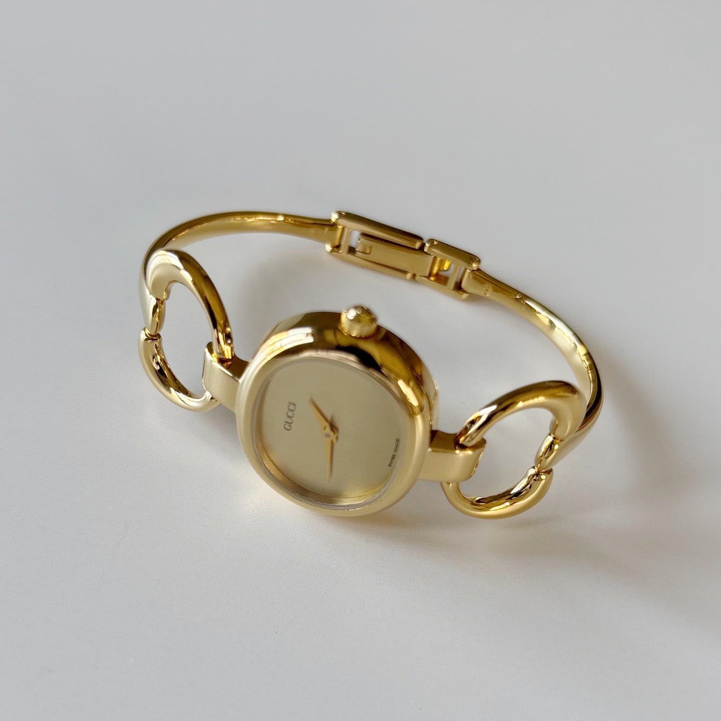 Gucci 1990s Oval Gold Dial Gold Plated Bangle Watch (Small)