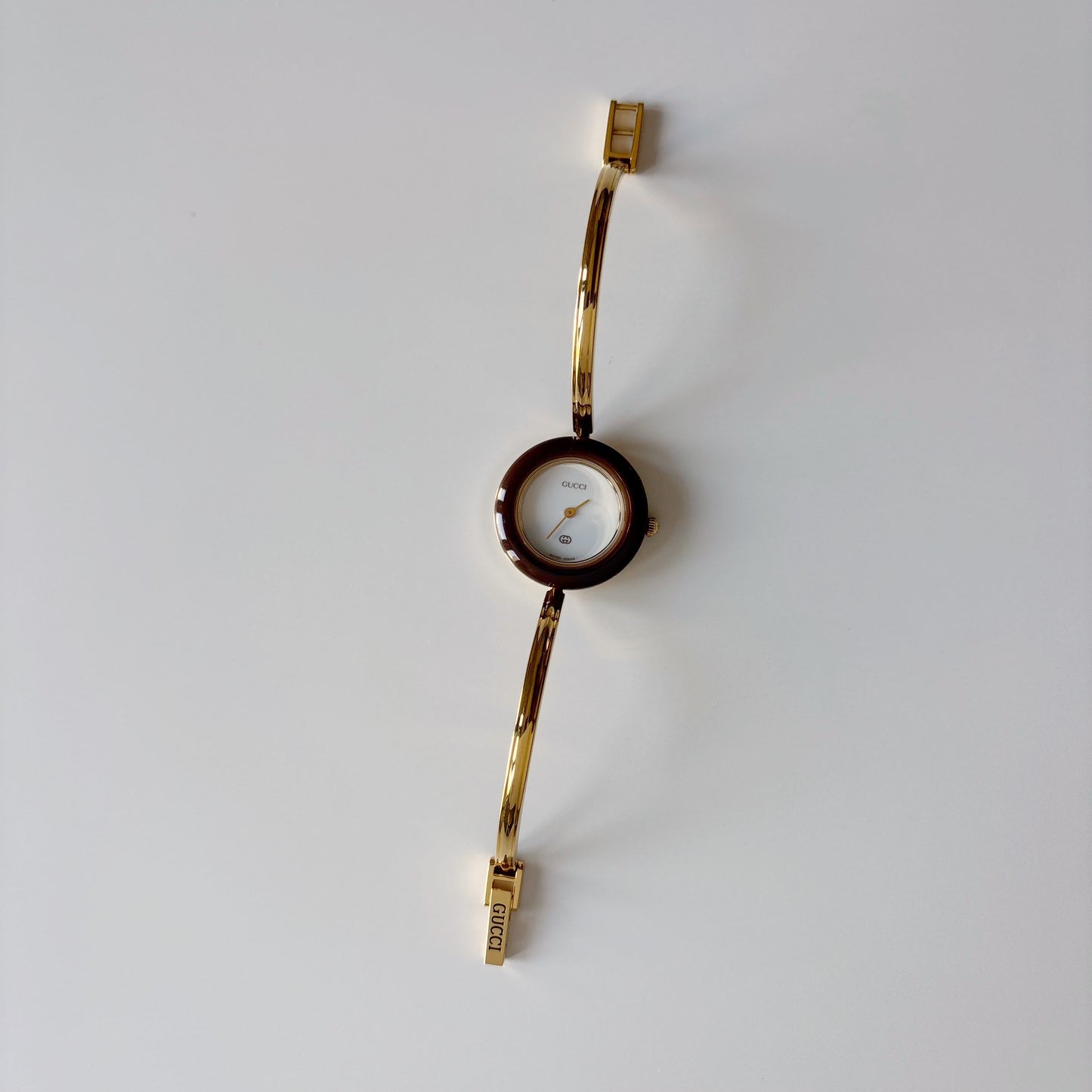 Gucci 1990s Interchangeable Bezel Gold Plated Bangle Watch with 12 bezels, case