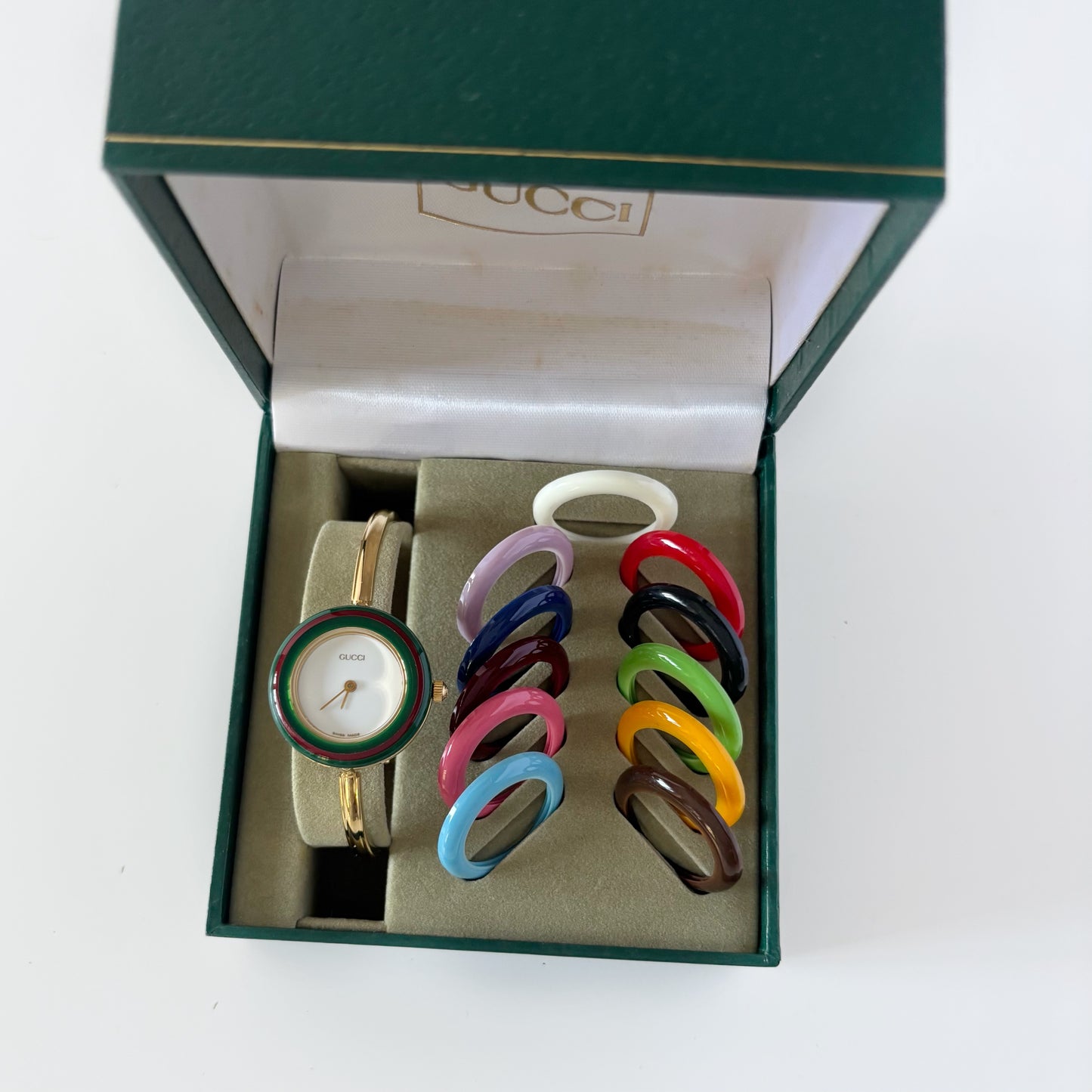 Gucci 1990s Interchangeable Bezel Gold Plated Bangle Watch with 12 bezels, case