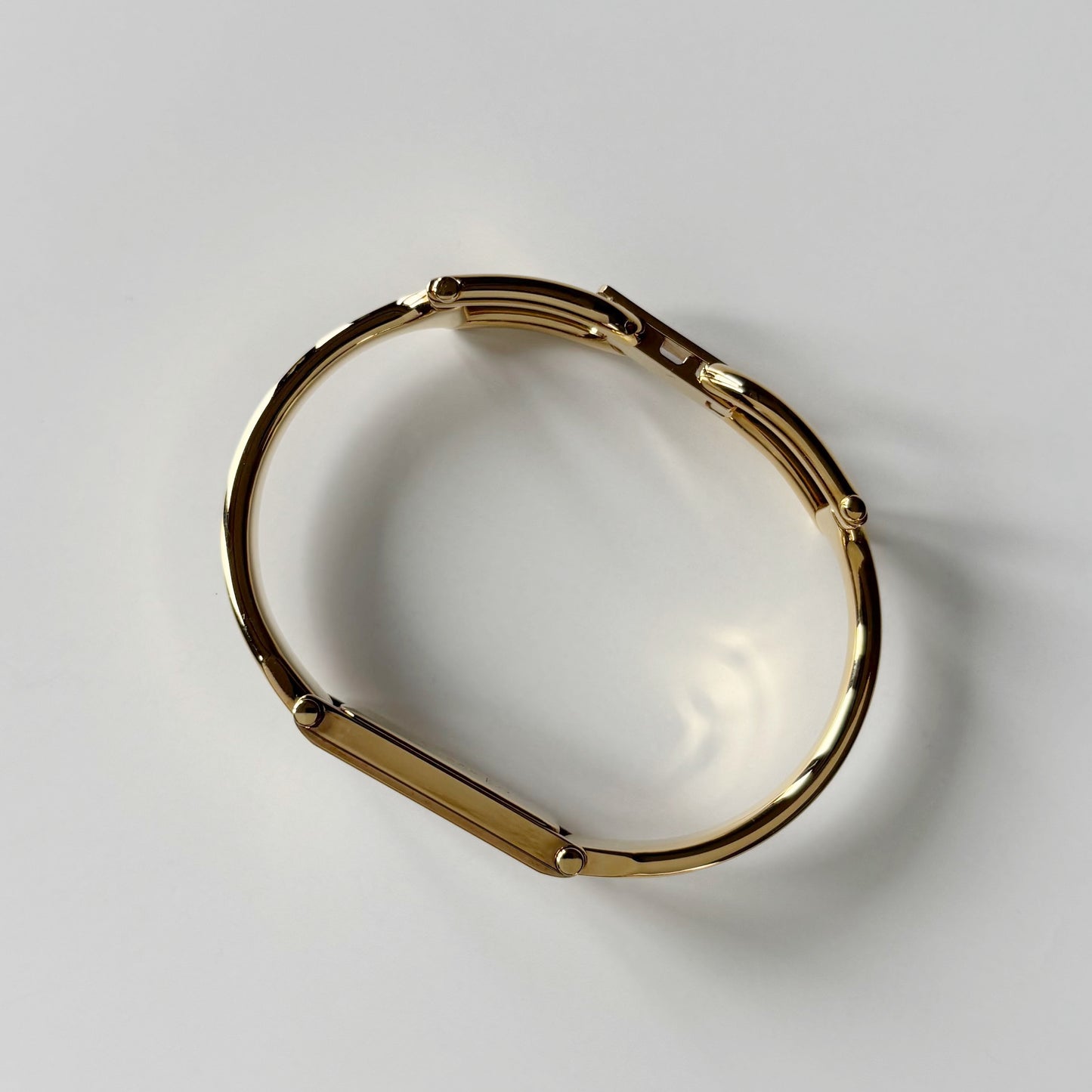 Gucci 1990s Gold Rectangular Dial Gold Plated Bangle Watch