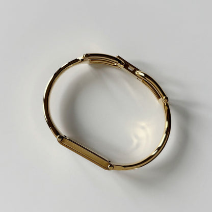 Gucci 1990s Gold Rectangular Dial Gold Plated Bangle Watch