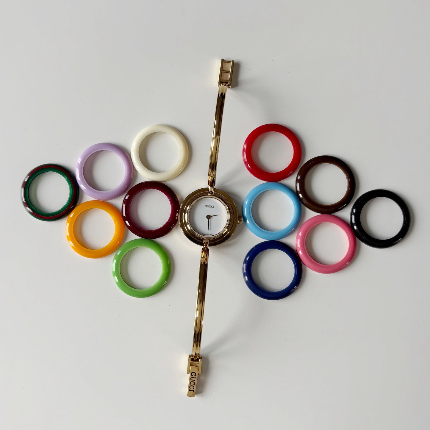 Gucci 1990s Interchangeable Bezel Gold Plated Bangle Watch with 12 bezels, case