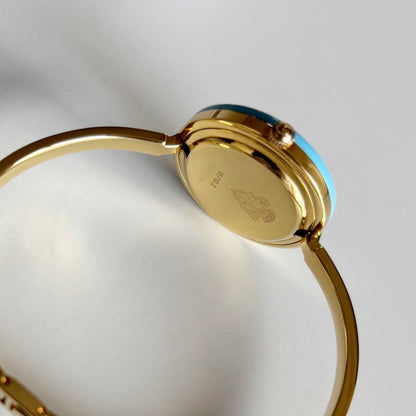 Gucci 1990s Interchangeable Bezel Gold Plated Bangle Watch with 12 bezels, case