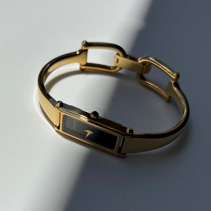 Gucci 1990s Black Rectangular Dial Gold Plated Bangle Watch