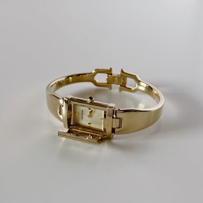 Yves Saint Laurent 1990s Peek-A-Boo Gold Plated Bangle Watch