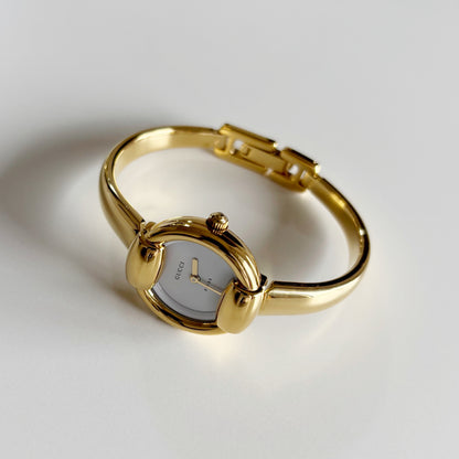 Gucci 1990s Round Dial Gold Plated Bangle Watch (Small)