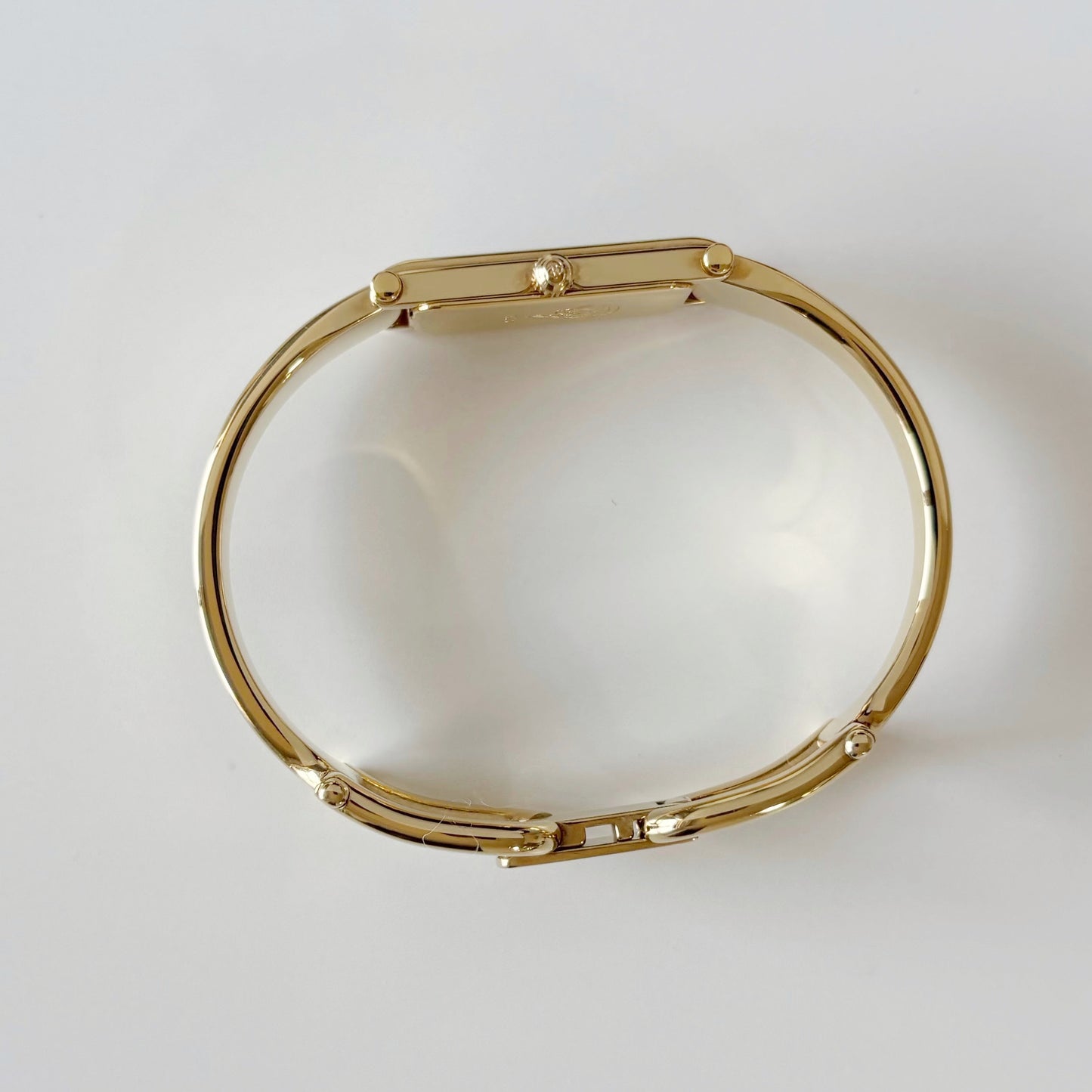 Gucci 1990s Cream Dial Rectangular Gold Plated Bangle Watch