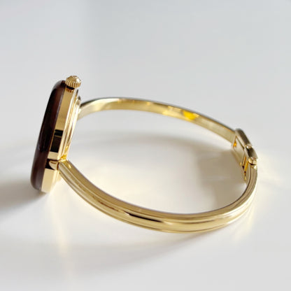 Gucci 1990s Interchangeable Bezel Gold Plated Bangle Watch with 12 bezels, case