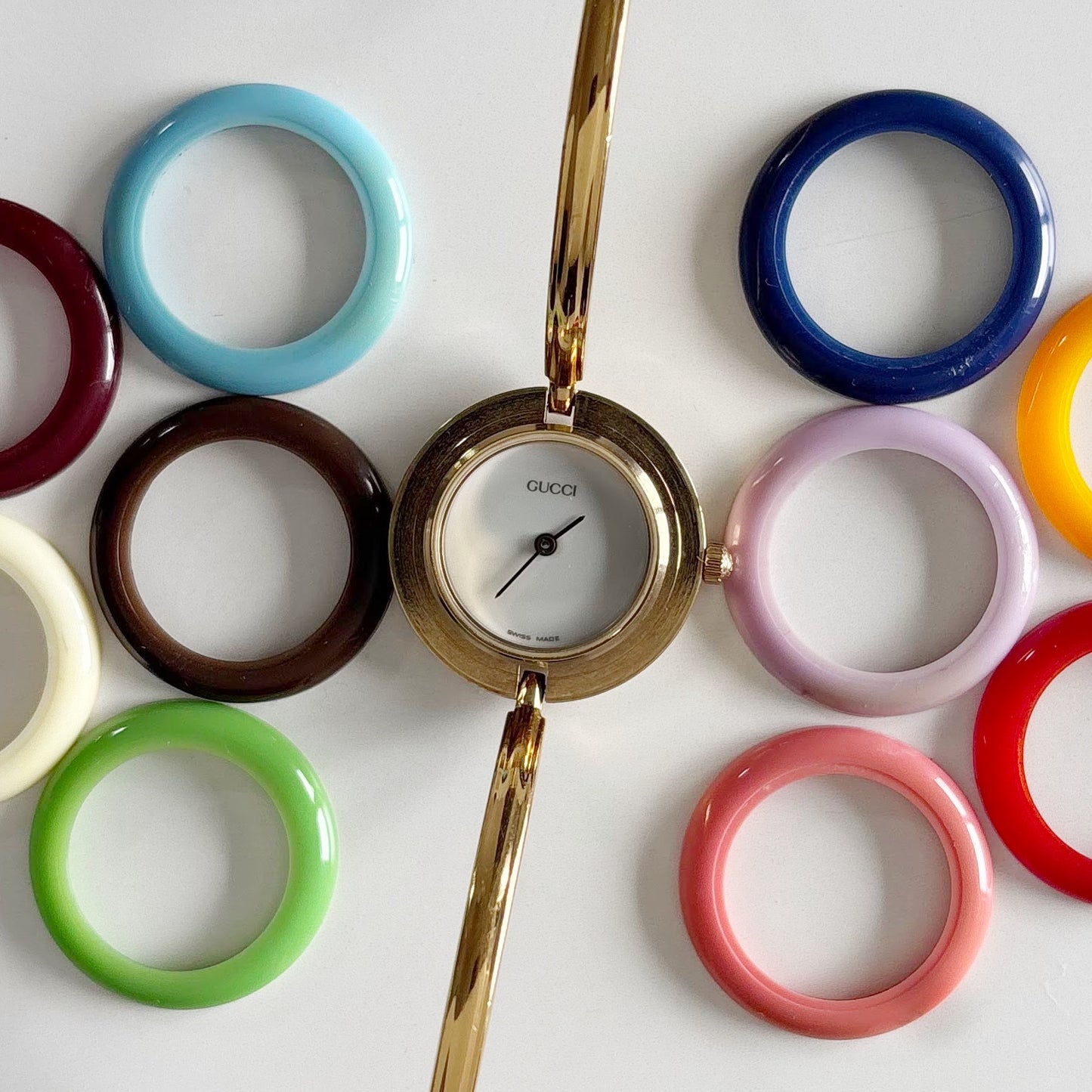 Gucci 1990s Interchangeable Bezel Gold Plated Bangle Watch with 12 bezels, case